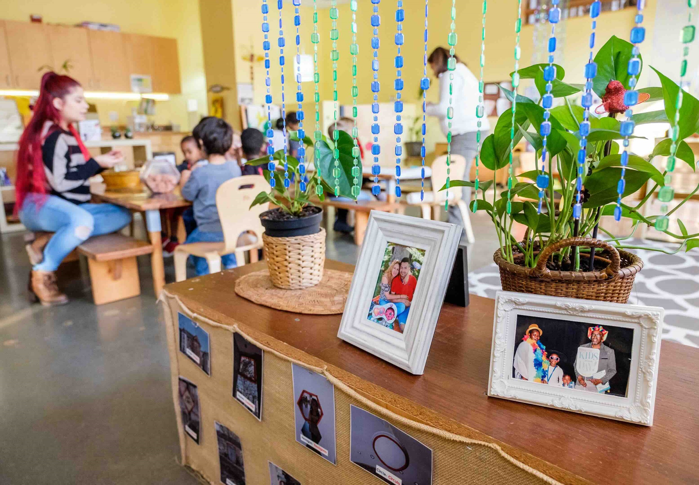 Photos of students' families are featured in a classroom at Southwest Early Learning Bilingual Preschool (SWEL) in Seattle, WA Photo by: ©Gates Archive/Stephen Brashear